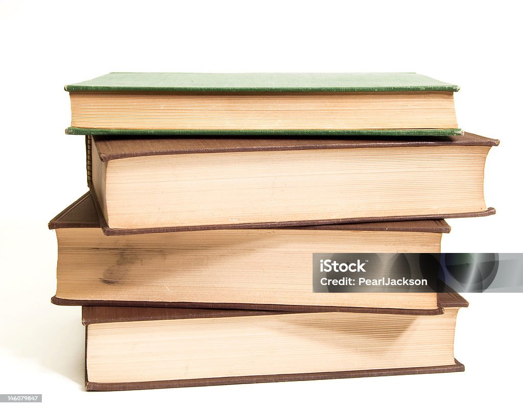 Books Pile of four books on white background. Document Stock Photo