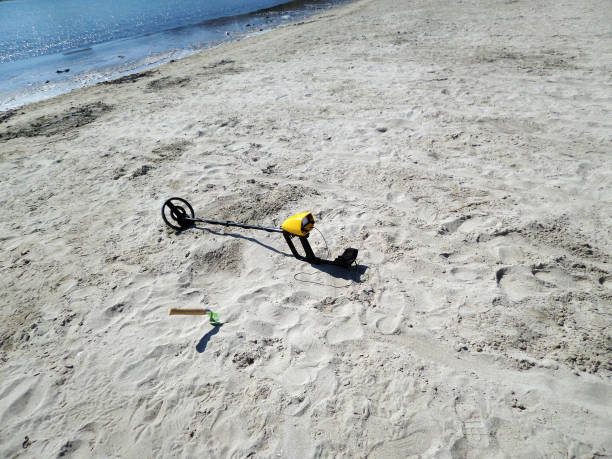 istock Metal detector on the beach. 1460798881