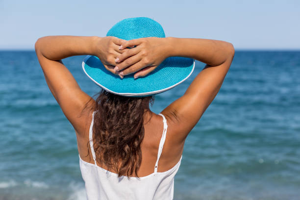 istock Woman relaxing at the seaside. 1460799225
