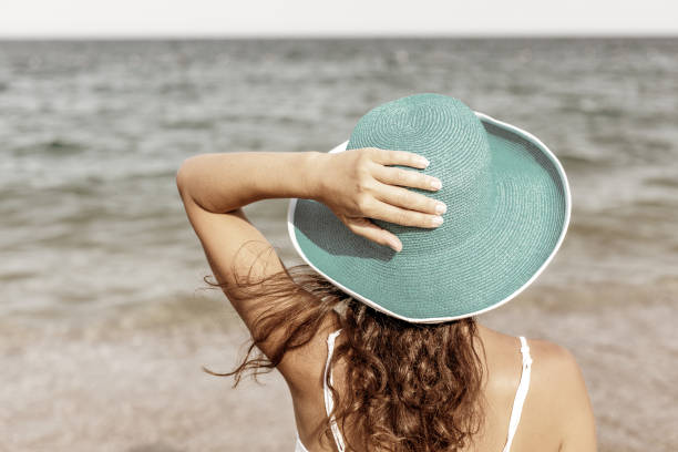 istock Woman relaxing at the seaside. 1460799251