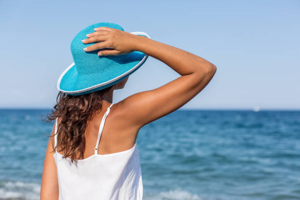 istock Woman relaxing at the seaside. 1460799258