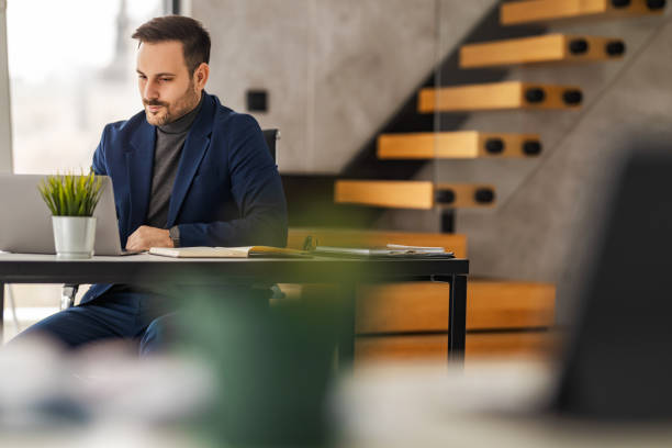 istock Serious young businessman having video call with client 1460801068