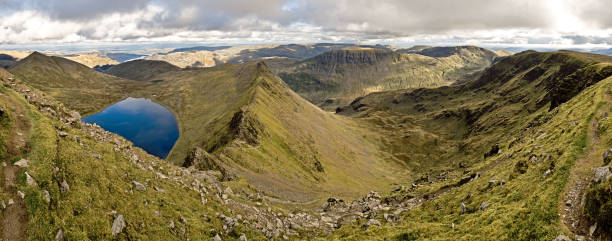 Red Tarn And Striding Edge From Helvellyn Taken at Helvellyn looking towards Red Tarn, Catstycam, Ullswater, Birkhouse Moor, Place Fell, Angletarn Pikes, St Sunday Crag, Striding Edge and Nethermost Pike. striding edge stock pictures, royalty-free photos & images