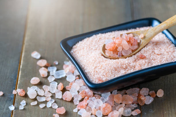istock Himalayan Rock pink Salt on wood spoon 1460805565