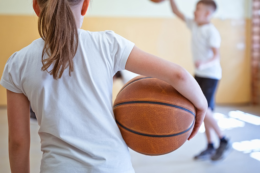 Female  School Basketball Team Playing Game