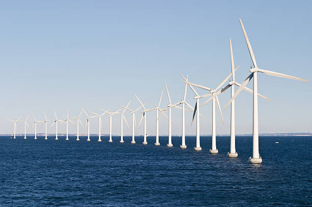 Offshore wind farm on a sunny cloudless day Wind power on the sea. offshore wind farm stock pictures, royalty-free photos & images