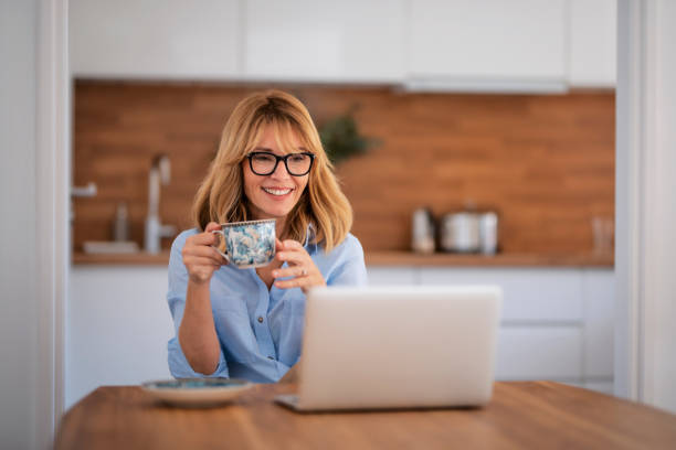 istock Smiling business woman working from home 1460807913