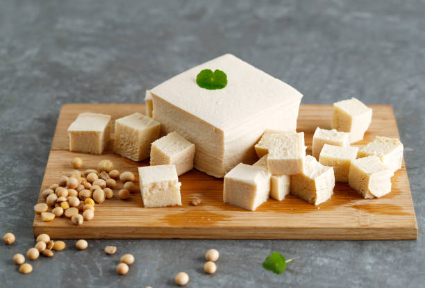 istock Tofu and Soy Bean on Wooden Chopping Board 1460808577