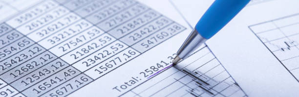istock Accounting document with pen, share listing and checking financial chart. Concept of banking, financial report and financial audit. 1460808674