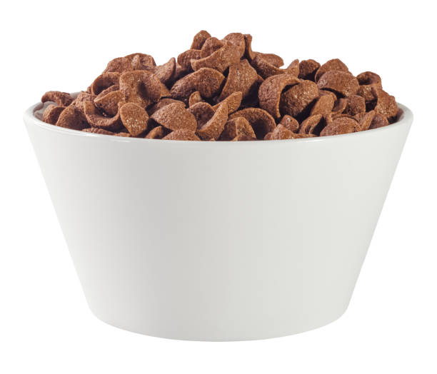 istock Chocolate cereals in white bowl. Chocolate flavored corn flakes. Wheat. Cocoa. Crispy. Crunchy. Breakfast. Snack. Granola. Oat. 1460809927