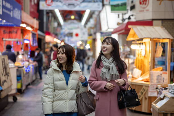 istock Female tourists visiting shopping mall 1460810199