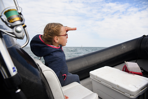 learning to fish at sea on a boat equipped with a depth sounder look at the horizon