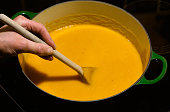 Homemade carrot soup in cast iron pot