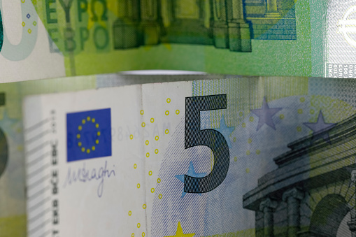 A fragment of the European Union banknote. Euro banknotes are not made of paper but of pure cotton fibre, which makes them more durable. Currency EUR.