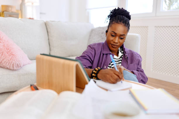 istock Young female student studying at home 1460812369