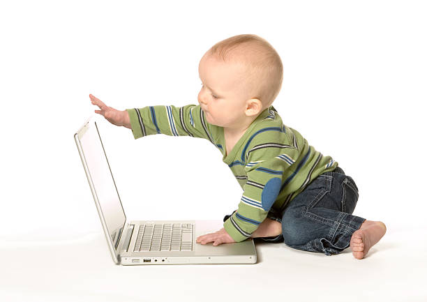 Baby with laptop stock photo