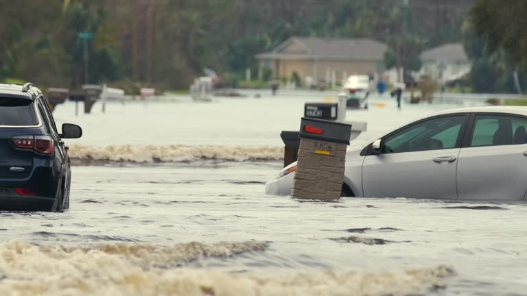 Flooded town street with trapped car submerged under water in Florida residential area after hurricane Ian landfall. Consequences of natural disaster