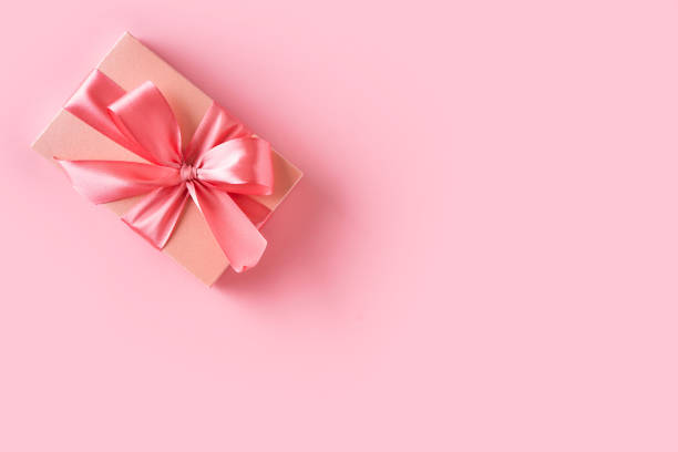 istock Pink gift box with bow on pink background 1460816819