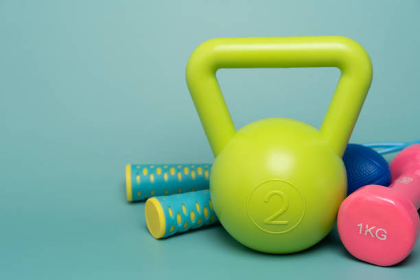 close up exercising sport equipment on green table background