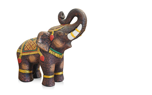 antique brown and yellow elephant standing, on white background, object, animal, statue, copy space