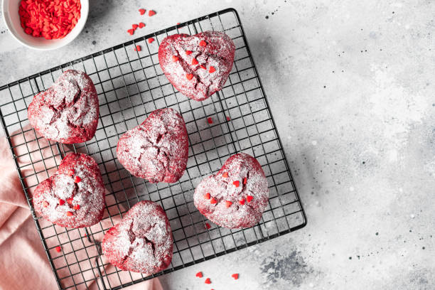istock heart shaped red velvet cupcakes with sprinkles on a cooling rack 1460819641