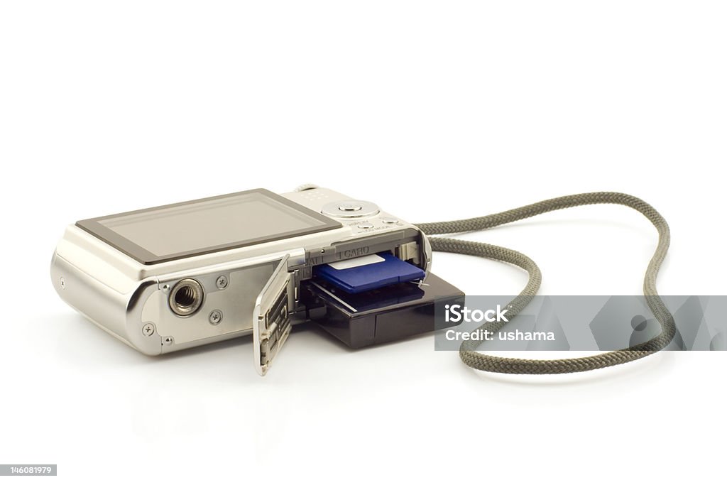 Battery and memory card in a compact camera Point and shoot digital camera with battery and sd card shown, white background Battery Stock Photo
