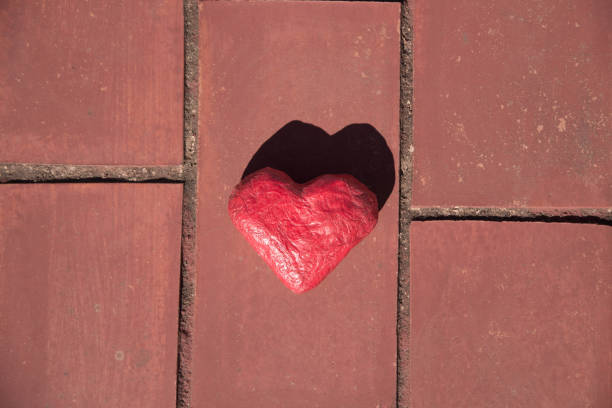 istock Red craft heart on the floor. 1460821611