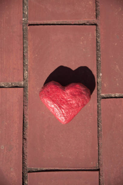 istock Red craft heart on the floor. 1460821613