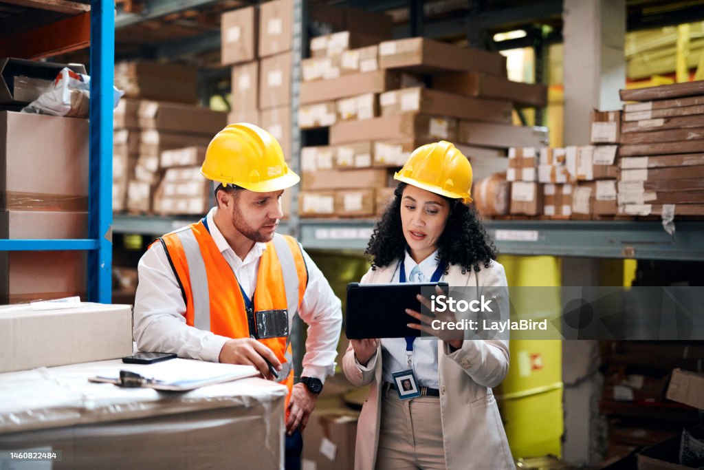 Warehouse, tablet and people teamwork for storage, inventory and supply chain management for b2b distribution. Factory, Industry partner or worker on digital technology, software and logistics boxes Freight Transportation Stock Photo