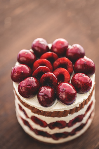 Cherry Cake On Wooden Board