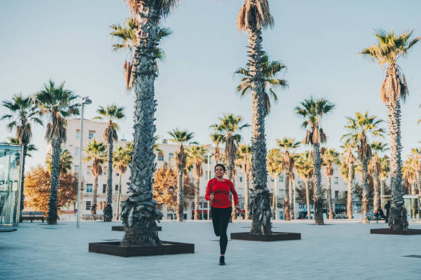 Sportswoman jogging in Barcelona stock photo