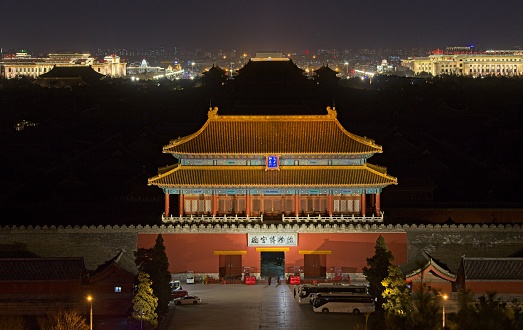 Night photo of dark Forbidden city. Only north gate is illuminated.