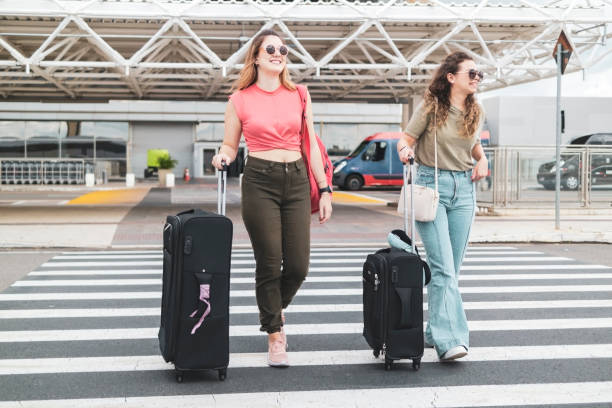 istock Two friends in the airport. 1460827589