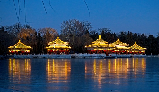 The pavilions were constructed during the Ming Dynasty in 1602, the 13th year of Emperor WanLi.\nThe middle pavillion is the largest and, unlike the others, it has a circular upper roof. It is known as 'Long Ze Ting' (Pavilion of Dragon Benevolence).\nIn the past, the emperor and his consorts would come here to fish, watch fireworks, or admire the moon over Jade Island.