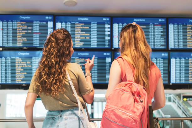 istock Two friends in the airport. 1460827637