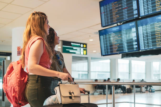 istock Two friends in the airport. 1460827657