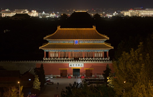 Night photo of dark Forbidden city. Only north gate is illuminated.