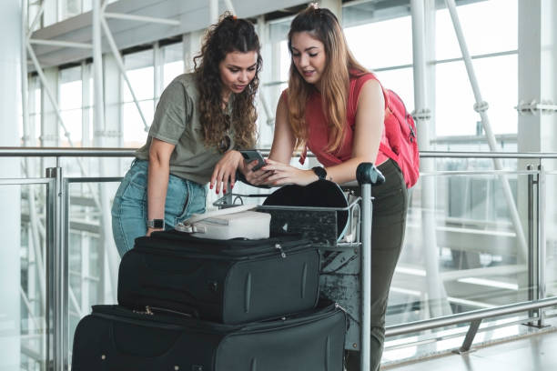 istock Two friends in the airport. 1460828803