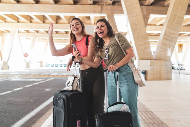istock Two friends in the airport. 1460828870