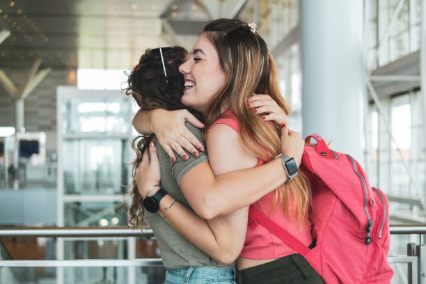 istock Two friends in the airport. 1460828914