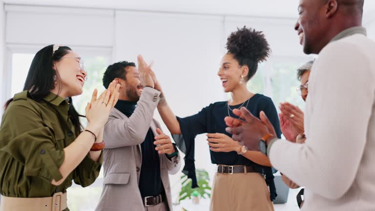High five, celebration and team clapping hands for success, achievement or collaboration goal. Applause, happy and excited business people celebrating successful teamwork or partnership in office.