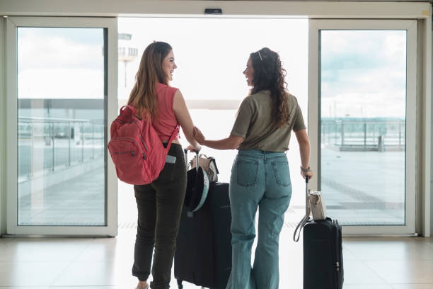 istock Two friends in the airport. 1460829206