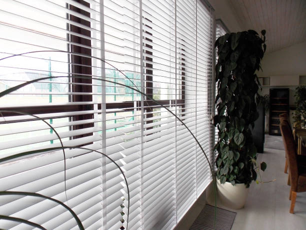 istock Wooden blinds white color in the interior. 1460829832