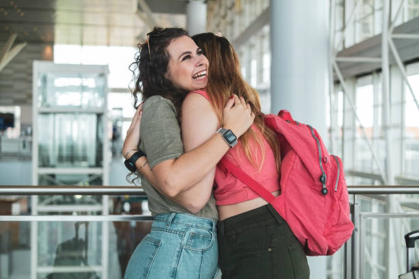 istock Two friends in the airport. 1460829945
