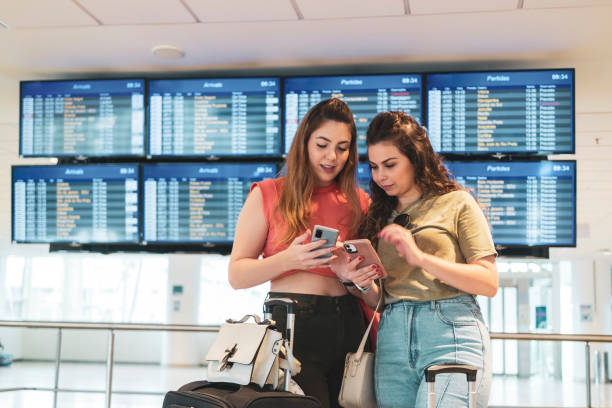 istock Two friends in the airport. 1460829971