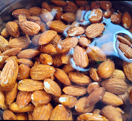 Almonds soaking in water so the skins become easy to remove