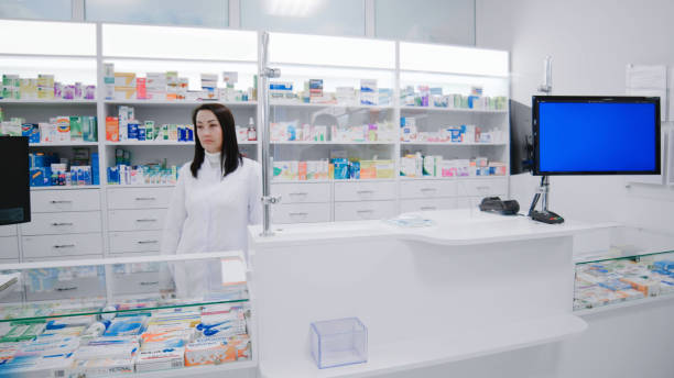 istock Pharmacist at the cash register during work at pharmacy 1460831069