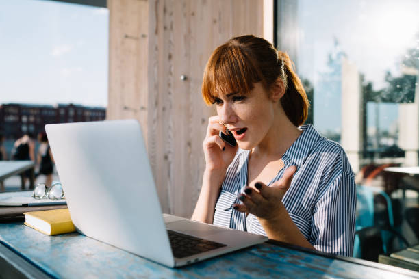 istock Emotional stressed caucasian woman stressed with software problems on laptop computer calling to service operator, shocked female confused wit getting invoice on mail from banking talking on cellphone 1460831366