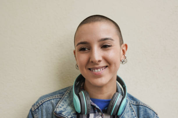 istock Happy bald girl smiling in front of camera 1460831627