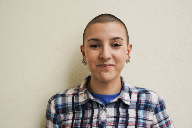 istock Young bald girl looking on camera 1460831632